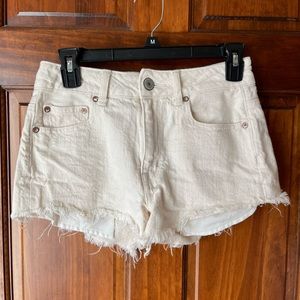 America Eagle High Rise Festival Shorts in White with Blue Print Pockets.